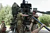Service members of Ukraine's 48th Separate Artillery Brigade load a shell into a 2S22 Bohdana self-propelled howitzer before firing towards Russian troops near a front line, amid Russia's attack on Ukraine, in Kharkiv region, Ukraine on July 27. [REUTERS/YONHAP]