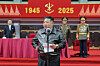 Kim Jong-un congratulates and encourages participants and organizers of the 80th anniversary celebrations of the party’s founding and watches a mass gymnastics performance and art show with them on Oct. 12. [RODONG SINMUN]