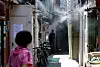 Cooling fog sprays mist in a jjokbang, or subdivided housing area, in Jongno District, central Seoul, on June 11, as early summer heat sets in. [JOONGANG ILBO]