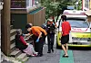 Emergency responders care for an older adult who collapsed near Seoul Station in Yongsan District, central Seoul, during the record-breaking heatwave on July 9. [YONHAP]