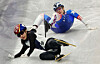 Kim Gil-li of Korea, bottom, is tripped by Corinne Stoddard of the United States during the semifinals of the mixed team relay in short track speed skating at the Winter Olympics at Milano Ice Skating Arena in Milan on Feb. 10. [KIM JONG-HO]