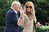 First lady Melania Trump waves as she walks with U.S. President Donald Trump before they depart for travel to Texas to tour areas affected by deadly flash flooding, from the South Lawn of the White House in Washington on July 11. [REUTERS/YONHAP]