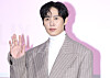 Actor Park Sung-hoon poses for photos during a press conference for the second season of ″Squid Game″ (2021-) held in Jung District, central Seoul, on Dec. 9. [NEWS1]