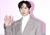 Actor Park Sung-hoon poses for photos during a press conference for the second season of ″Squid Game″ (2021-) held in Jung District, central Seoul, on Dec. 9. [NEWS1]