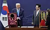 President Lee Jae Myung, right, presents U.S. President Donald Trump with the Grand Order of Mugunghwa and a model of the Cheonmachong gold crown at the Gyeongju National Museum in Gyeongju, North Gyeongsang on Oct. 29. [JOINT PRESS CORPS]
