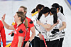 Members of Korea’s women’s curling team console one another after a 10-7 loss to Canada in the round-robin match at the Milan?Cortina Winter Olympics at the Cortina Curling Olympic Stadium in Italy on Feb. 19. The defeat ended their hopes of advancing to the semifinals. [YONHAP]