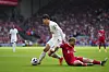 Tottenham's Son Heung-min, left, and Liverpool's Harvey Elliott fight for the ball during the match between Liverpool and Tottenham Hotspur at Anfield Stadium in Liverpool, England on Sunday. [AP/YONHAP]