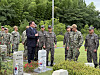 South Korean Navy and Commander U.S. Naval Forces Korea personnel visit a burial site where Korean servicemen who served in the Korean Augmentation to the United States Army (Katusa) were laid to rest at UN Memorial Cemetery in Korea in Busan on June 24. [LEE SOO-JUNG]