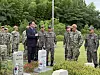 South Korean Navy and Commander U.S. Naval Forces Korea personnel visit a burial site where Korean servicemen who served in the Korean Augmentation to the United States Army (Katusa) were laid to rest at UN Memorial Cemetery in Korea in Busan on June 24. [LEE SOO-JUNG]