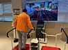 A staff member demonstrates an interactive game that requires users to step on a pad at Seoul Inclusive Digital Plaza in Gangdong District, eastern Seoul, on Dec. 18. [CHO JUNG-WOO]