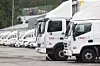 Coupang delivery vehicles are seen parked at a logistics center in Seoul on Aug. 6. [YONHAP]