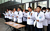 Professors at Jeju National University's medical school call on the government to abandon its plan to increase medical recruitment by 2,000 slots next year on Friday. [YONHAP]