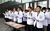 Professors at Jeju National University's medical school call on the government to abandon its plan to increase medical recruitment by 2,000 slots next year on Friday. [YONHAP]