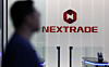 A person passes by Nextrade (NXT) logo at NXT's headquarters in Yeouido, western Seoul, on March 3. [YONHAP]