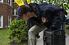 A law enforcement official works at the scene of an address listed in public records as the home of Elias Rodriguez, who police identified as the suspect in the killing of two staff members of the Israeli Embassy in Washington on May 22 in Chicago. [AP/YONHAP]