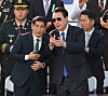 Former Defense Minister Kim Yong-hyun, left, speaks with President Yoon Suk Yeol in central Seoul during a military parade in October. [JOINT PRESS CORPS]