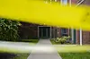 Police tape is tied around a gate outside of a building at an address listed in public records as the home of Elias Rodriguez, who police identified as the suspect in the killing of two staff members of the Israeli Embassy in Washington on May 22 in Chicago. [AP/YONHAP]