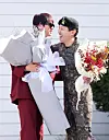 BTS member Jin, left, greets his bandmate J-Hope as the latter finishes his military duty on Oct. 17 in Wonju, Gangwon. [YONHAP]