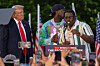 Rapper Sheff G, also known as Michael Williams, right, joins then Republican presidential candidate Donald Trump during a campaign rally in the Bronx borough of New York on May. 23, 2024. [AP/YONHAP]