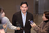 Shinsegae Group Chairman Chung Yong-jin talks to reporters at Incheon International Airport on Dec. 22 after returning from his trip to the United States, where he met with U.S. President-elect Donald Trump and Tesla and X CEO Elon Musk. [YONHAP]