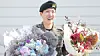 BTS's J-Hope greets reporters and fans after finishing his mandatory military duty on Oct. 17 at his base camp in Wonju, Gangwon. [NEWS1]