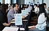 Job seekers talk to company executives at a job fair in Dong District, Busan, on May 21, 2024. [JOONGANG ILBO]