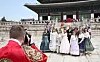 Foreign tourists take photos near Gyeongbok Palace in central Seoul on May 1. [YONHAP]