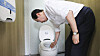 Prime Minister Han Duck-soo wipes a toilet seat while inspecting facilities at the World Scout Jamboree in Buan County, North Jeolla, on Aug. 4, 2023. [YONHAP]