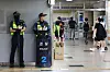 Police officers stationed a Seohyeon Subway Station in Bundang, Gyeonggi, on Aug. 4, 2023, the day after 22 year-old Choi Won-jong tried to attack random people with a knife. [YONHAP]
