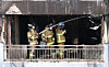 Firefighters put out the remaining fire inside an apartment building in Changjeon-dong, Mapo District, in western Seoul on Aug. 17. [YONHAP]