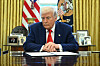 U.S. President Donald Trump prepares to sign an executive order in the Oval Office of the White House in Washington on April 9. [AFP/YONHAP]