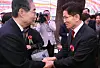 Former Prime Minister Han Duck-soo, left, and People Power Party presidential candidate Kim Moon-soo shake hands at an event for Buddha's Birthday at the Jogye Temple in Jongno District, central Seoul, on May 5, 2025. [JOINT PRESS CORPS]