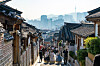 Tourists roam the streets at Bukchon Hanok Village in central Seoul. [BAEK JONG-HYUN]