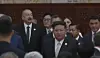 Woo Won-shik, speaker of the National Assembly, is seen behind North Korean leader Kim Jong-un at a reception in Beijing on Sept. 3, held to celebrate the 80th anniversary of the end of World War II. [YONHAP NEWS TV]