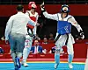 Korea's Park Hye-jin, right, celebrates after a victory over Lin Wei Chun of Chinese Taipei in the women’s -53kg final held at Lin'an Sports Culture Convention & Exhibition Center Gymnasium in Hangzhou, China on Tuesday. [YONHAP]