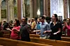 Attendees hold hands during the first Sunday Mass following the election of Pope Leo XIV as the Catholic Church's new leader and first U.S.-born pontiff, at the Cathedral of St. Matthew the Apostle in Washington on May 11. [REUTERS]