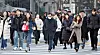 People in heavy winter clothing walk through Gwanghwamun Intersection in central Seoul on Nov. 26. [NEWS1]