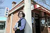 Lee In-hye, a former curator at the National Folk Museum of Korea, recently published a book titled ″The History of Washing” (2024). Lee poses for a photo in front of an old public bathhouse near the National Folk Museum in central Seoul. [JOONGANG ILBO]