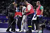 Azerbaijan's Gashim Magomedov is helped by members of his team after being injured in the taekwondo men's -58kg final against Azerbaijan's Gashim Magomedov at the Grand Palais in Paris on Wednesday. [AP/YONHAP]