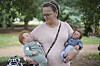 Ana Paula Vilela holds her dolls during a group gathering to bond and show off their hyper-realistic reborn baby dolls, in a park in Sao Paulo, May 24. [AP/YONHAP]