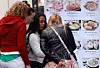 Foreign tourists look at Korean food menus in Myeongdong, central Seoul, on Oct. 20. [YONHAP]