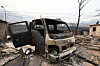 A truck is destroyed after a wildfire began in Uiseong County in North Gyeongsang swept Hwangjang-ri in Yeongdeok County on March 27. [KIM JONG-HO]