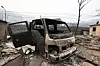 A truck is destroyed after a wildfire began in Uiseong County in North Gyeongsang swept Hwangjang-ri in Yeongdeok County on March 27. [KIM JONG-HO]