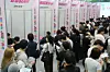 Jobseekers sit down for consultations at company booths set up at a job fair in Busan on Sept. 10. [YONHAP]