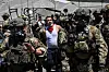 Law enforcement officers, including members of the Immigration and Customs Enforcement Special Response Team and Homeland Security agents, arrest a demonstrator outside the Federal Building as protests continue in response to federal immigration operations in Los Angeles on June 10. [AFP/YONHAP]