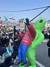 An anti-Yoon Suk Yeol protesters dressed up as Donald Trump and an alien walks through the crowd in central Seoul near Anguk Station on Apr. 4. [YOON SEUNG-JIN]