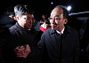 Rep. Choo Kyung-ho, right, of the People Power Party smiles as he leaves the Seoul Detention Center in Uiwang, Gyeonggi on Dec. 3 after attending a court hearing to decide on his potential arrest. [NEWS1]