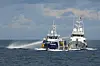 In this photo provided by the Philippine Coast Guard, a Chinese Coast Guard vessel, right, fires it's water cannon at the Philippine's BRP Datu Pagbuaya near Philippine occupied Thitu island locally called Pag-asa island at the South China Sea on Oct. 12. [AP/YONHAP]