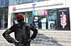 A person stands in front of an SK Telecom retail store in Seoul on May 2 to replace his subscriber identity module (SIM) card free of charge. [YONHAP]
