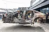 The burnt Mercedes EQE sedan is transferred for a thorough investigation in Incheon. [NEWS1]